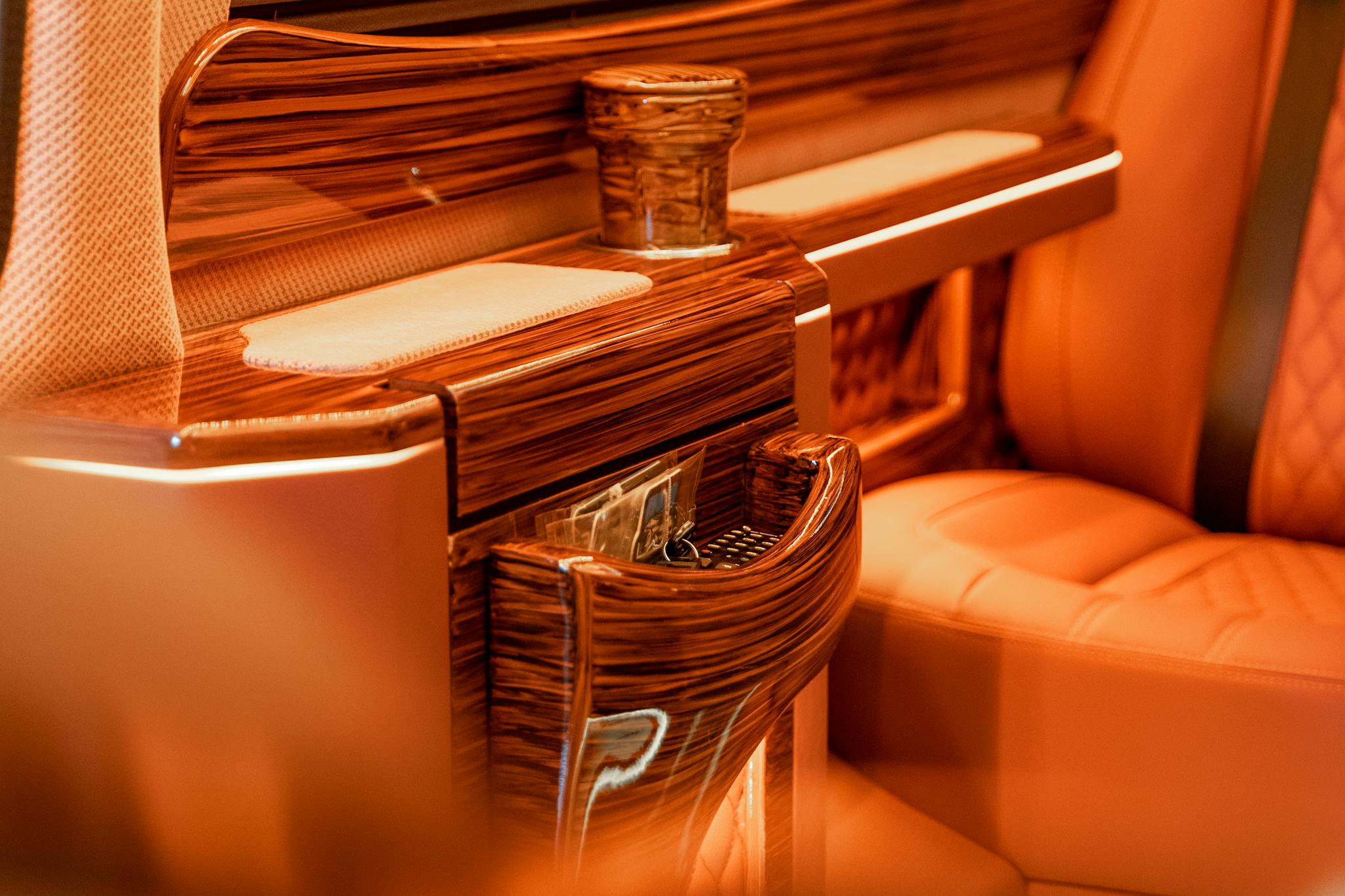 Elegant close-up of luxury wooden seating design in warm tones.